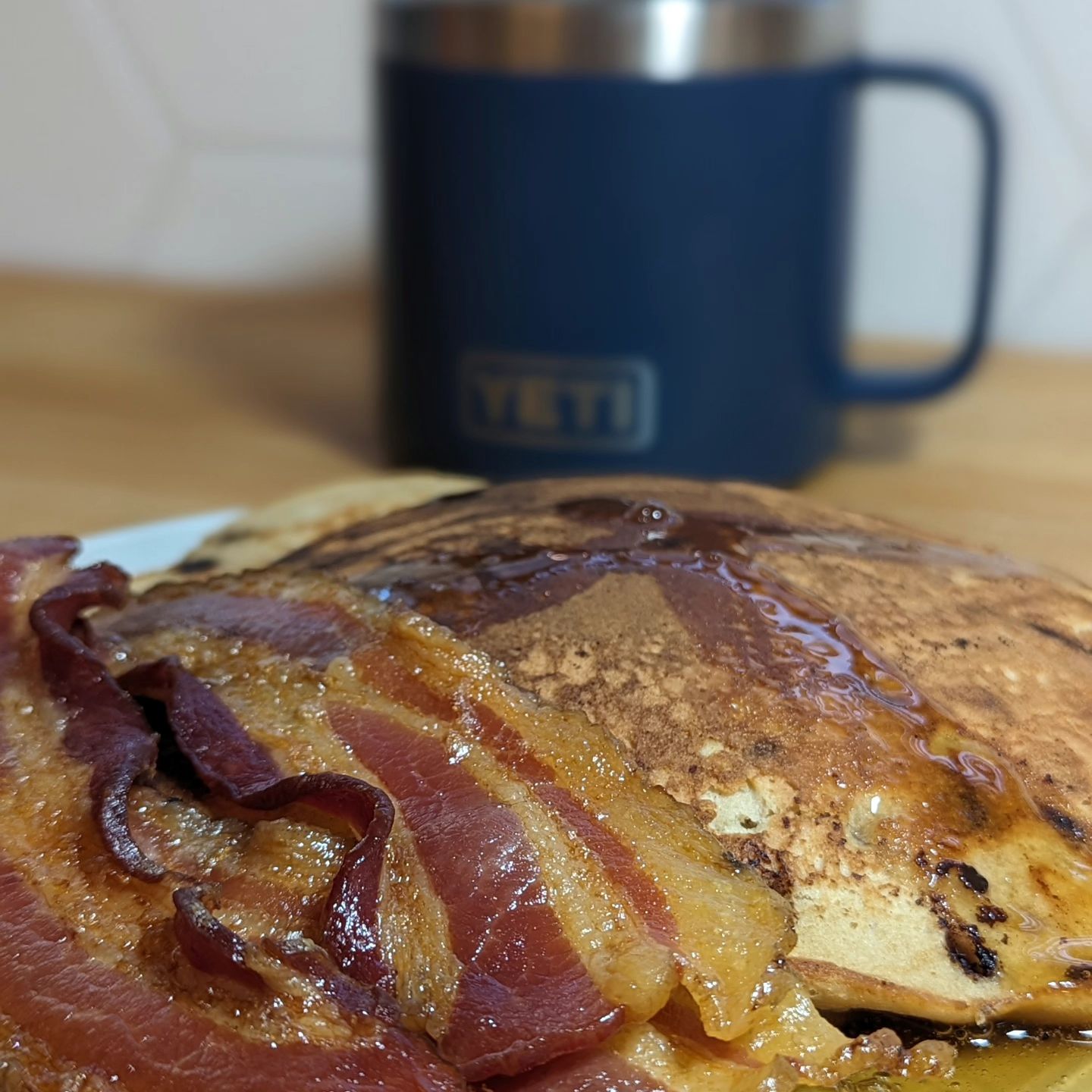 This was breakfast from over the weekend. I love the pancake mix from @carbonautbaking and added a little extra @lilys_sweets chocolate chips. Served with a side of my home cured bacon of course and topped with @birchbenders keto friendly syrup. Coffee on the side because we can never have too much caffeine. This is one of my most craved breakfasts though I gotta say, I always leave wanting more protein. Thinking I need to add some breakfast sausage to this meal.
