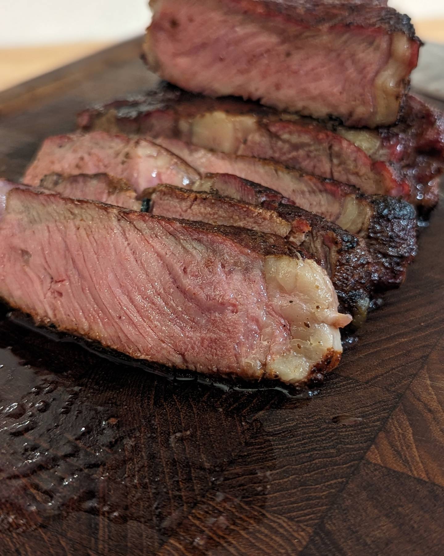 Sometimes you just need steak.Reverse seared, smoked to 118, pan seared to 132, rested and sliced. @bearmountainbbq gourmet blend did most of the work here before a quick sear in my @hexclad pan.I used the @thermomaven_culinary to keep me honest with my temps. Check out how quick that thermometer updates! #steak #steakdinner #beef #reverseseared #panseared #searingsteak #platofmeat #simplepleasures