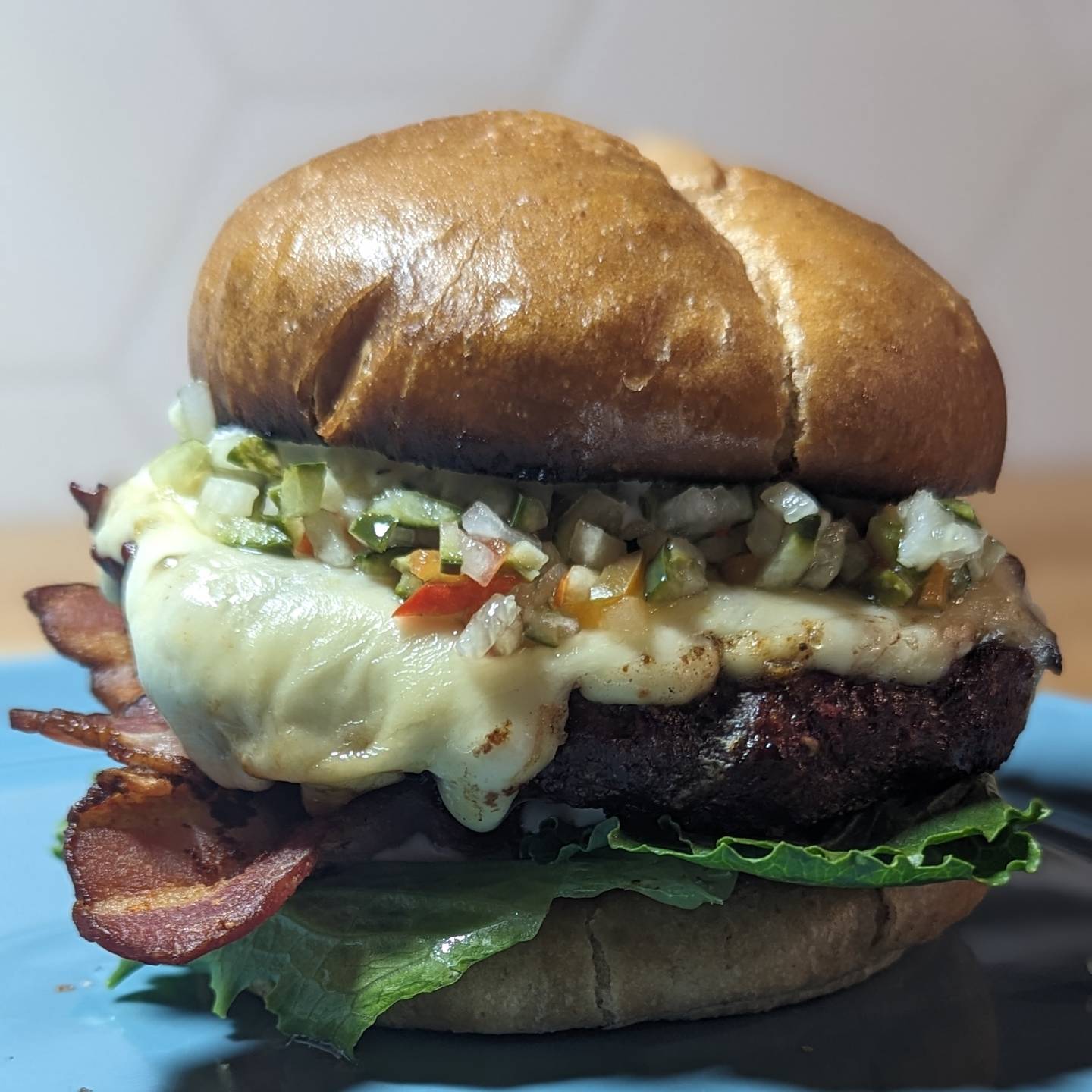 Bacon Cheeseburger!Smoked the burger with @bearmountainbbq  Hickory wood pellets, topped it with tons of pepper jack cheese and let that melt. The bun is a @hero low carb bun, with @litehousefoods ranch on both the top and bottom. A little romaine lettuce, some bacon and @grillospickles pickle de Gallo wrap things up. If I were to giveaway a Bear mountain gift card would you be interested? Let me know in the comments! The burger is seasoned with @neilsarap wild game rub. Between the rub and the smoke. That is all you really needed.#burger #cheeseburger #baconcheeseburger #pickles #hamburger #eatinggood  #bearmountainbbq  #smokedmeats