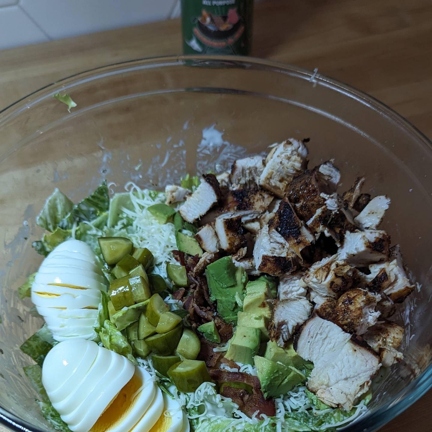 Cobb Salad with grilled chicken breastRomaine lettuce tossed in @litehousefoodsHome style ranch for the base. The chicken was cooked using @bearmountainbbq hickory pellets and seasoned with @neilsarap southwest ap. Joining the chicken was hard boiled eggs, avocado, bacon, pepperjack cheese and diced spicy pickles. Yes, I ate a mixing bowl sized salad. While the bowl isn't full. Tossing everything together is much easier in a giant bowl.#cobbsalad #saladsofinstagram #grilledchicken #bearmountainbbq #eatinghealthy #dinnersalad #loadedsalad