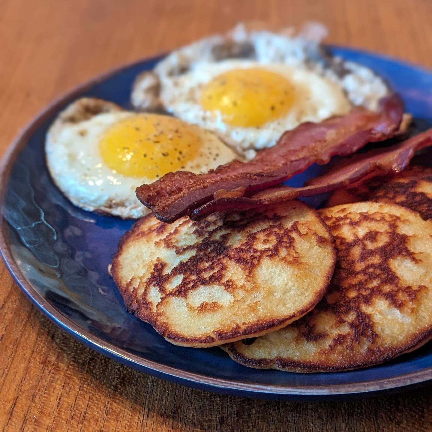Classic breakfast Two eggs, two strips of bacon and pancakes These @birchbenders pancakes absolutely hit the spot. These are the keto ones, cooked in butter medium heat and were just perfection. Paired with crispy bacon and the eggs were perfectly runny for dipping the pancakes into. #classicbreakfast #pancakebreakfast #weekendvibes #brunchgoals