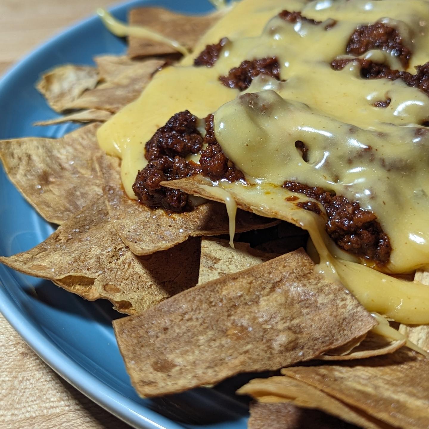Low carb chorizo nachosThis was a lot of fun, my first time using Sodium Citrate. The cheese sauce was totally like the canned stuff but made at home with ingredients I control! I warned 1 cup of heavy cream on the stove and dissolved in a tablespoon sodium citrate (I would use less next time, or add more liquid) then with it fully integrated i slowly added in 1 lb of @tillamook sharp cheddar cheese (grated). As each handful melted in I added the next handful. I kept the cheese mix around 150 degrees through this process. Once all the cheese was mixed in I added a can of green chilies and a bit of @tdsbrewbbq zesty taco seasoning. I then bumped the heat slightly to thin the cheese out a little more (heat helps thin it). In the oven I cooked some @cutdacarb which I had sliced and sprayed with avocado oil. 375 for about 8 minutes, then turned off the oven and they sat till ready to use. The @caciquefoods pork chorizo was cooked on the stove top. Then it was time to assemble. The layer of chips, then a layer of cheese sauce, the chorizo and one final layer of cheese sauce. I don't think I can call this one healthy, given I ate about half my cheese sauce so say a half lb of cheese and 1/2 cup of cream... And nearly a whole tube of chorizo... But it was damn good comfort food! #nachos #stadiumnachos #ballparknachos #cheesesauce #cheeserecipes #nachorecipe #comfortfood #chorizo #cheddarcheese