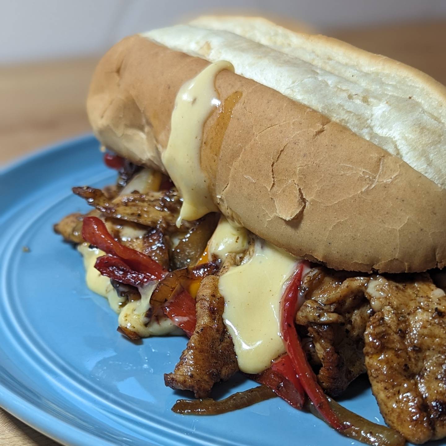 Chicken Cheesesteak sandwich Thin sliced chicken, onions, peppers and cheese sauce. That cheese sauce u made was the perfect cheese base for so many meals, ready to go and just add liquid to adjust consistency. Yes, that's a real roll. #cheesesteak #cheesesauce #cheesedrip #chickencheese #sandwichoftheday #sandwiches