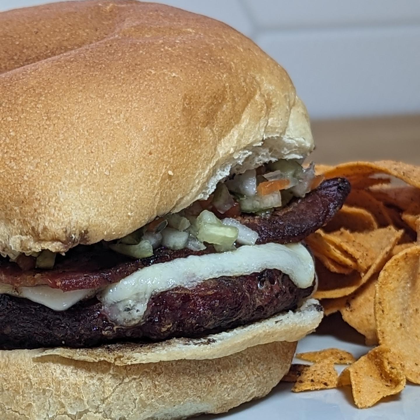 Bacon cheeseburger Kept it classic(ish) hereGrilled the burger over @bearmountainbbq hickory, melted some jack cheese. The bacon was also cooked up above the burger to start and the. Moved to toast the bun. I added some mustard and @grillospickles pickle de Gallo. Served with a side of @wildechips queso chips. Nothing else needed here. Absolutely delicious. #cheeseburger #baconcheeseburger #bearmountainbbq #hamburger #grilledburger #burgerseason #bbqtime #summertime