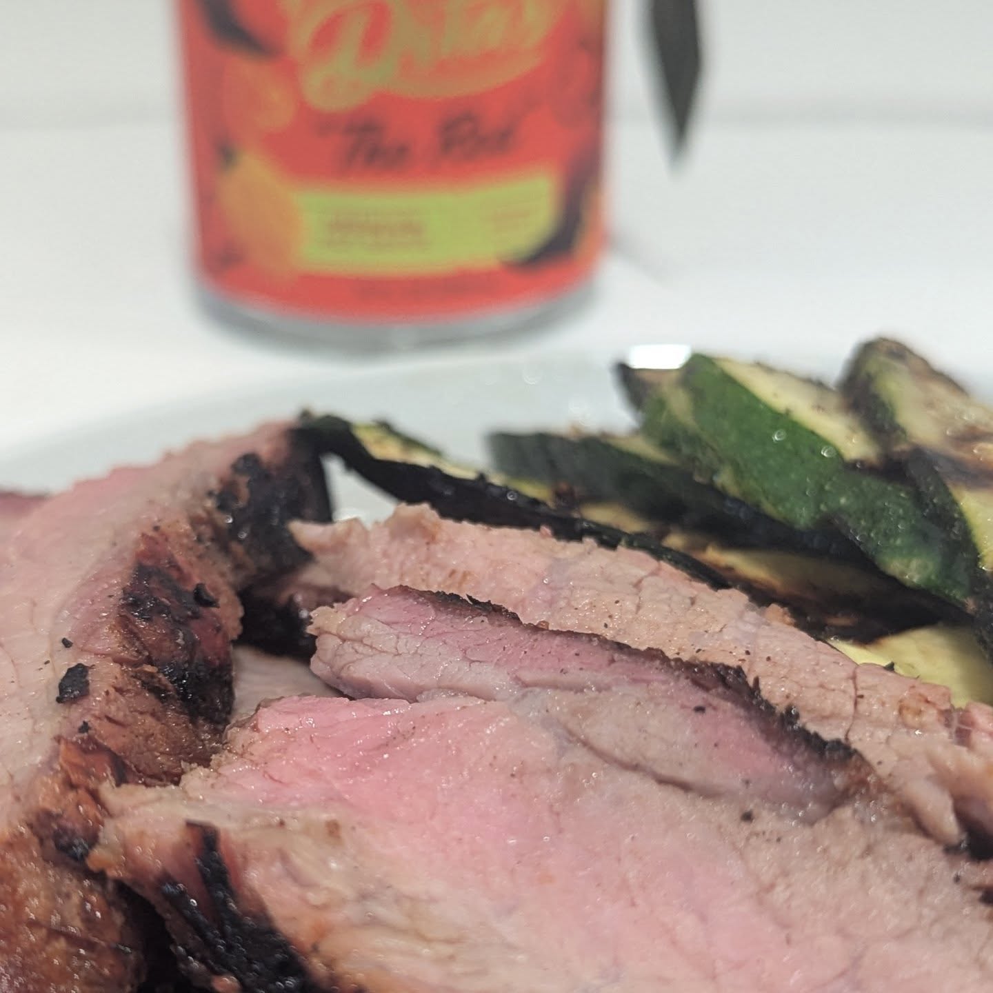 Reverse seared tri tip and drilled zucchini I marinated the tri tip in @mamaditasauces red sauce. With the meat marinated, I smoked it using the amazing flavor of @bearmountainbbq red white and blue blend pellets. They add so much flavor to the meat, giving it that perfect balanced smoke as an undertone to the spice from the sauce. The low and slow two hours of smoke permeated deeply into the tri-tip and set it up for a hard sear over the open flame. With the grill nice and hot from the seat I threw on  some sliced zucchini as a side dish. These pellets run so clean in the @yodersmokers  and make summer cooks a breeze. Not having to heat the house on 85+ degrees days is such a blessing. #tritip #meatandveggies #mamadita #bearmountainbbq #yodersmokers #grilling #steakdinner