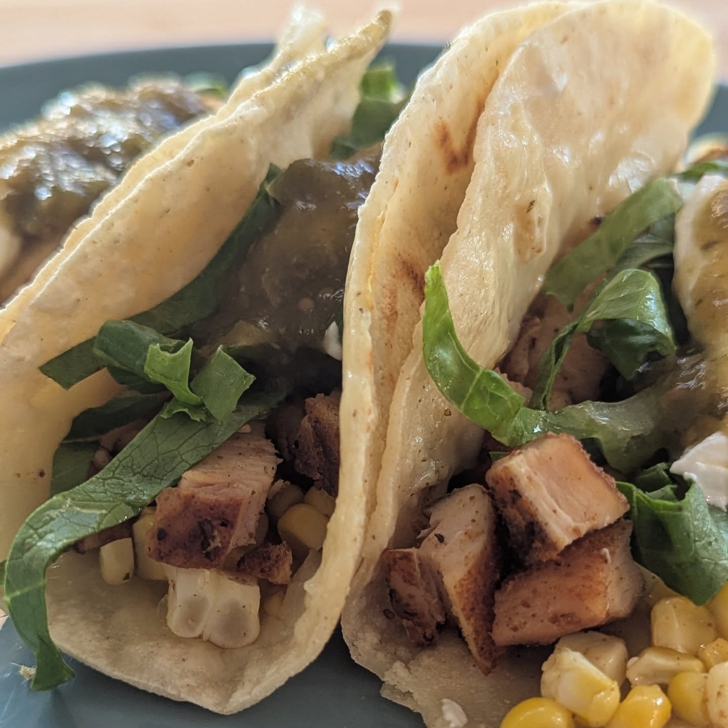 Chicken and corn tacos. I used the @bearmountainbbq cherry smoked chicken breast leftover from yesterday to make some tacos! The chicken was cubed and warmed in a pan while the tortillas were heated and coated with @cabotcreamery cheese. I had some leftover grilled corn as well. So that went in with a touch of lettuce, sour cream and salsa. Easy dinner done right. #taconight #tacotuesday #bearmountainbbq #chickentacos