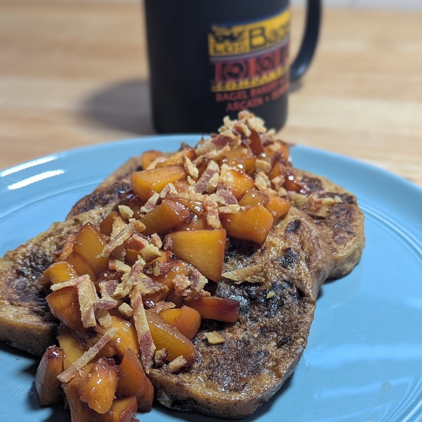 French toast with peaches and baconSourdough French toast, loaded with cinnamon and vanilla to make the whole house smell amazing. Topped with peaches cooked with a bit of brown sugar and topped with crispy bacon. Did I mention how amazing the house smelled? Ya. This was a top notch breakfast. #frenchtoast #summerpeaches #bacon #alwayscoffee