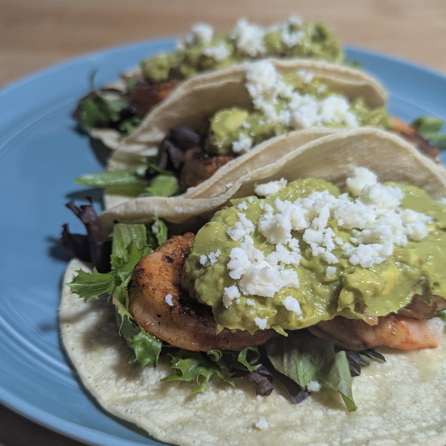 Do tacos heal your soul too? These shrimp tacos were exactly what I needed. I used @spiceology black magic rub to bring the bold flavor and cooked with @bearmountainbbq gourmet blend, directly over the flame for a really clean burning wood fired flavor. Shrimp takes on a ton of flavor and quickly, so using a really nice wood pellet brings amazing flavor with ease. The grilled shrimp were piled into a base of @cabotcreamery cheddar, someday mixed greens and topped with guac and queso fresco. The guac was a simple mix of avocado, sour lines, @spiceology and roll and a splash of chipotle salsa. That chipotle brings out the wood fired flavor from the shrimp even more. #shrimptacos #tacos #tacotuesday #bearmountainbbq #cabotcheese #spiceology #grilledtacos