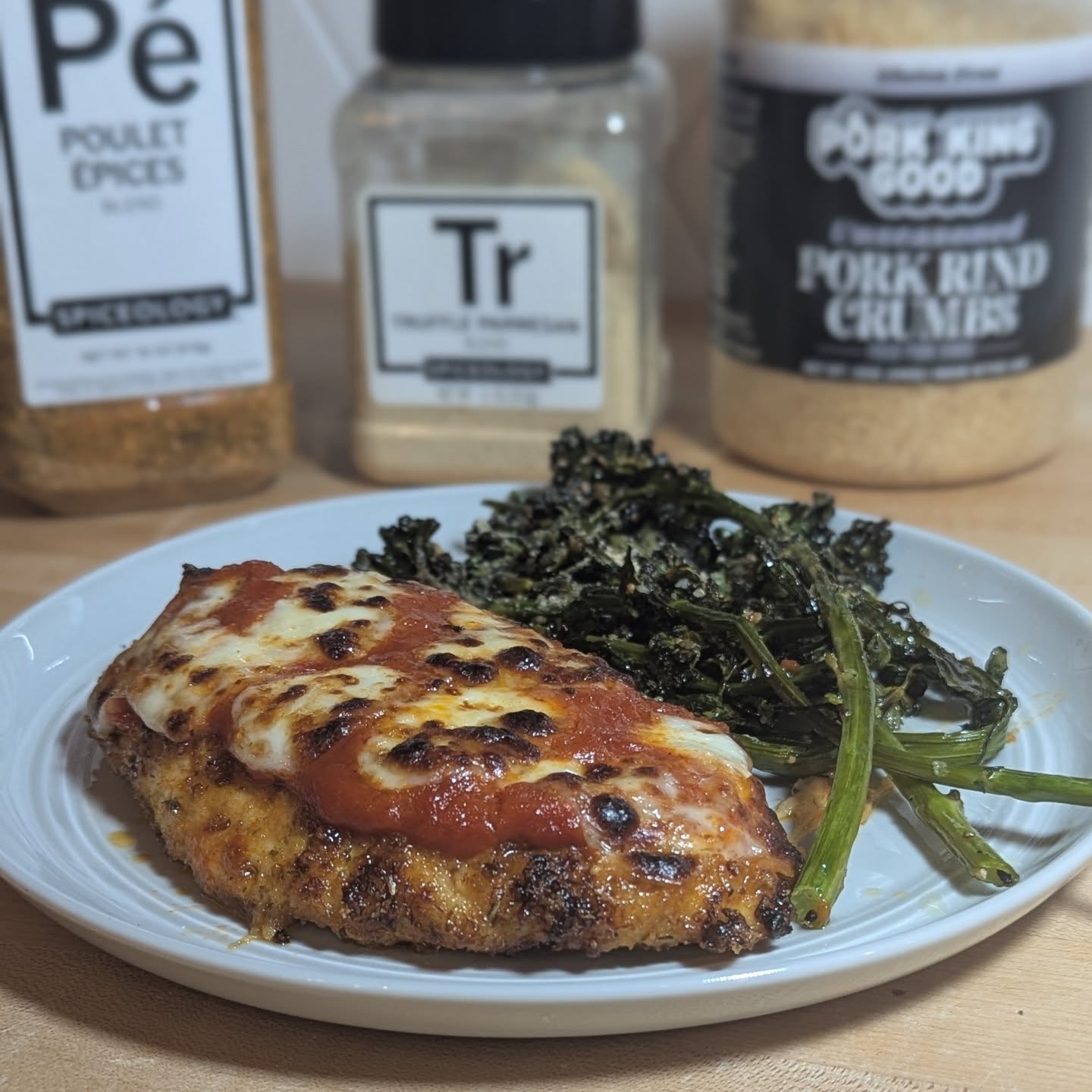 ​Keto Comfort Food Dream!​Say hello to the ultimate gluten-free Chicken Parmesan! ​This dish is a game-changer for anyone doing Keto or just looking for a delicious, low-carb alternative. I achieved that perfect, crispy crust not with traditional breadcrumbs, but by using the amazing @porkkinggood Pork Rind Crumbs! Seriously, they fry up so perfectly.​The chicken breast was pan-fried to golden-brown perfection and then topped with a simple marinara and rich, fresh mozzarella—melty goodness in every bite. ​Flavor Secrets:​The chicken was seasoned with @spiceology Poulet Épices for a complex, aromatic base.​The side of broccolini and crisp kale got a special upgrade, dusted with a Truffle Parmesan blend for an extra layer of savory richness.​What's your favorite comfort food to make low-carb? Let me know in the comments! ​#KetoChickenParm #GlutenFreeEats #LowCarbDinner