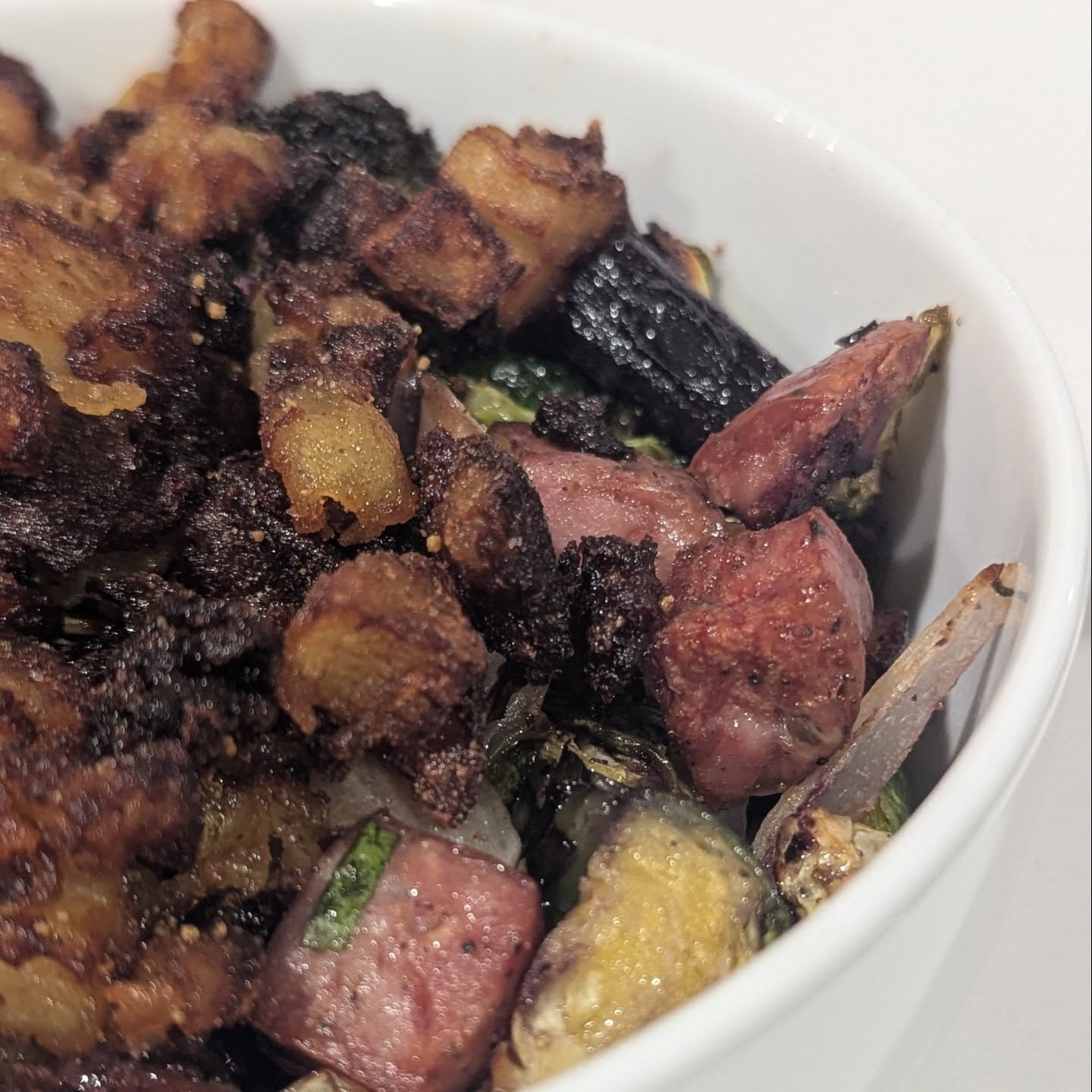 A little more food for fuel. Sheet pan dinner with crispy potatoes. This is Brussels, carrots, broccoli, and onion all tossed in avocado oil and seasoned with @spiceology cowboy candy and @boarsnightout white lightning. I also cut up some adells sausage and tossed that on top to bake. While it baked I cubed some potatoes, pan fried them, and then tossed em in cowboy candy. The chicken sandwich was my cooked chicken from stir fry, drizzled in buffalo sauce and served with @grillospickles on a store bought bun. Soup was a cheese soup with a veggie base, using carrots, onion, celery and broccoli with chicken bone broth, tons of @cabotcreamery cheddar cheese, some cream cheese and topped with sausage and bacon. I did use some xanthan gum as a thickener.Finally some low carb tortillas loaded with sauteed chicken breast, avocado, jalapeno, some lettuce, sour cream and cheddar cheese. Chicken was cooked in taco seasoning and salsa.#mealsfortheweek #healthymeals #dinnerideas