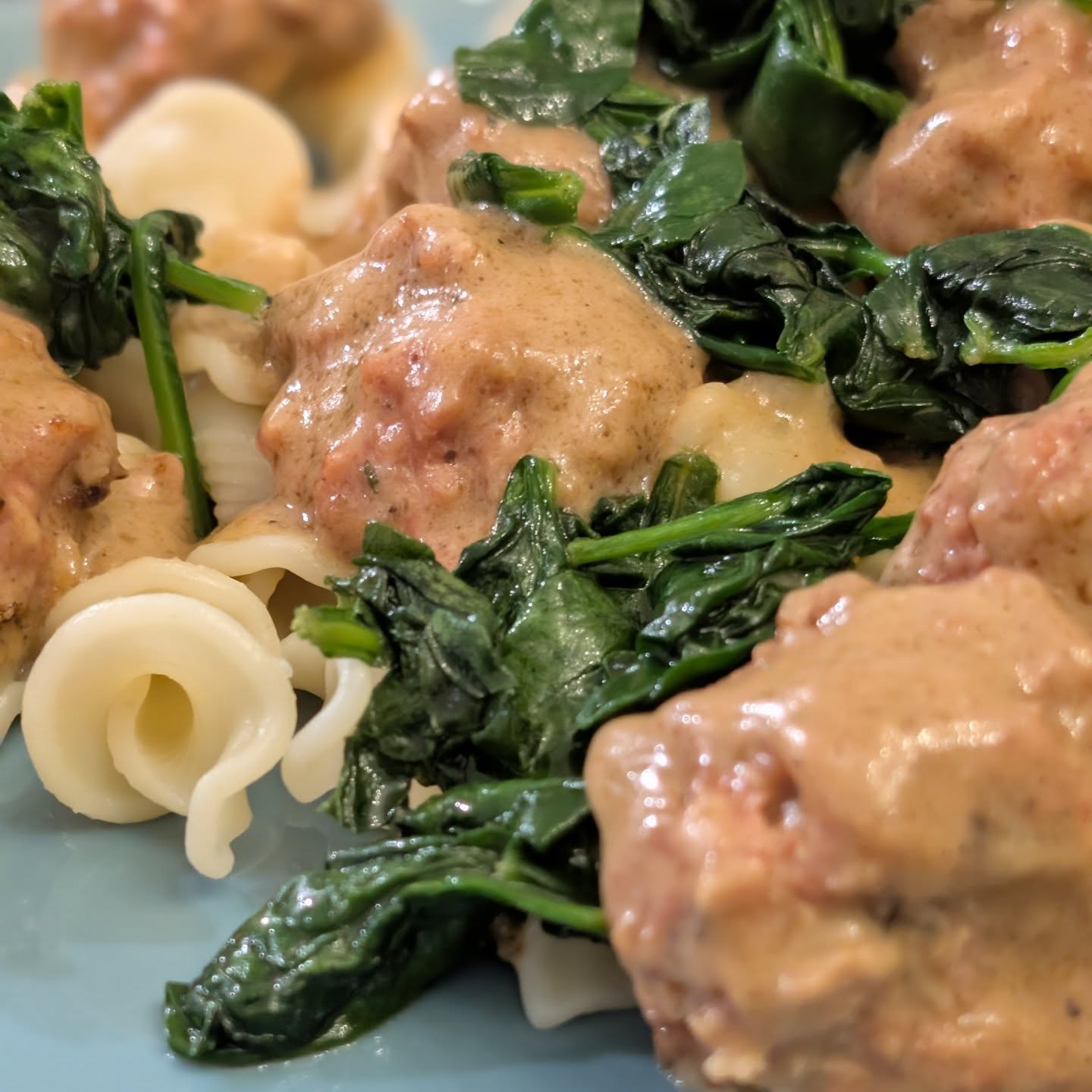 Some recent meals, in order. Swedish meatballs with sauteed spinach and noodles. Smoked chicken breast with caramelized onions and cheese. Buffalo chicken saladChicken  and bacon cheeseburger Chicken fried riceThe meatballs and chicken were both smoked for a nice subtle difference for maybe traditional approaches, but the added sweet smoke from @bearmountainbbq apple wood was a really lovely addition. In a rare twist I did the burgers inside on the griddle pan, but loaded then up with lots of cabot cheese which took them to the next level. The fried rice is always tasty. With a unique add of asparagus, because why not. Topped with green onion, chili crisp and @spiceology togarashi helped step it up. #bearmountianbbq #cabotcheese