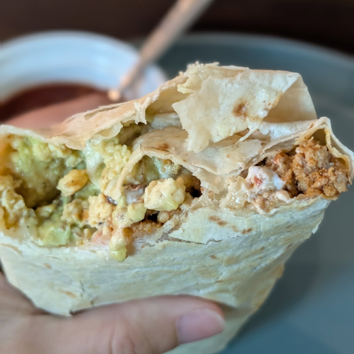 Breakfast Burritos Just hit the spot. Do you ever have one ingredient that just inspires the whole meal? Today that was @cabotcreamery smoky bacon cheddar cheese. I started with some slices melting in a tortilla, leftover ground turkey from tacos, added soft scrambled eggs, guac and sour cream and some bacon to really amp up that bacon cheddar. Everything got tightly rolled and served up with a little side of salsa. Now the real question, how much cheese did I eat while preparing the burrito. You'll never know! Shhhh! #breakfast #chedder #burritos